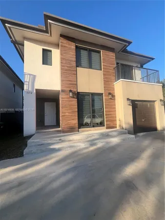 a front view of a house with a garage