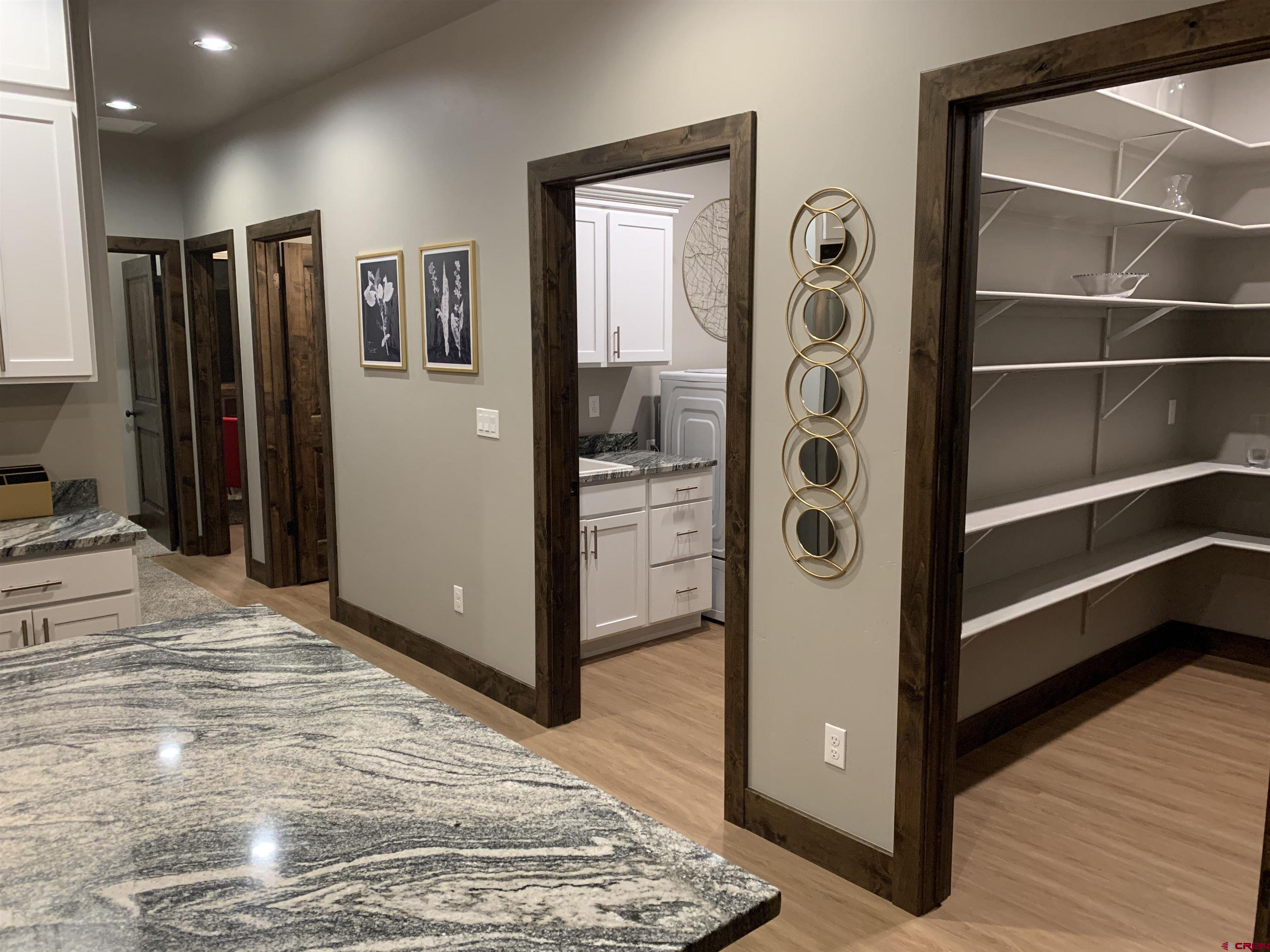 2533 Bear Lake Drive Montrose, CO 81401 - Photo 11 of 34 a view of a hallway with closet and wooden floor