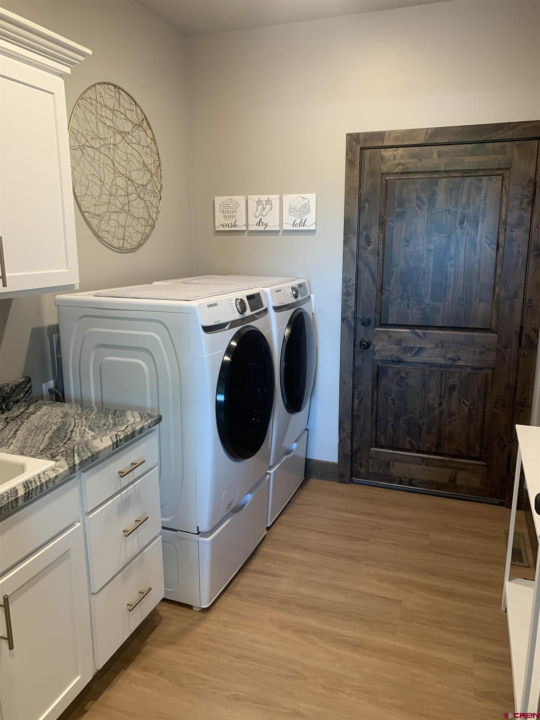2533 Bear Lake Drive Montrose, CO 81401 - Photo 12 of 34 a utility room with dryer and washer