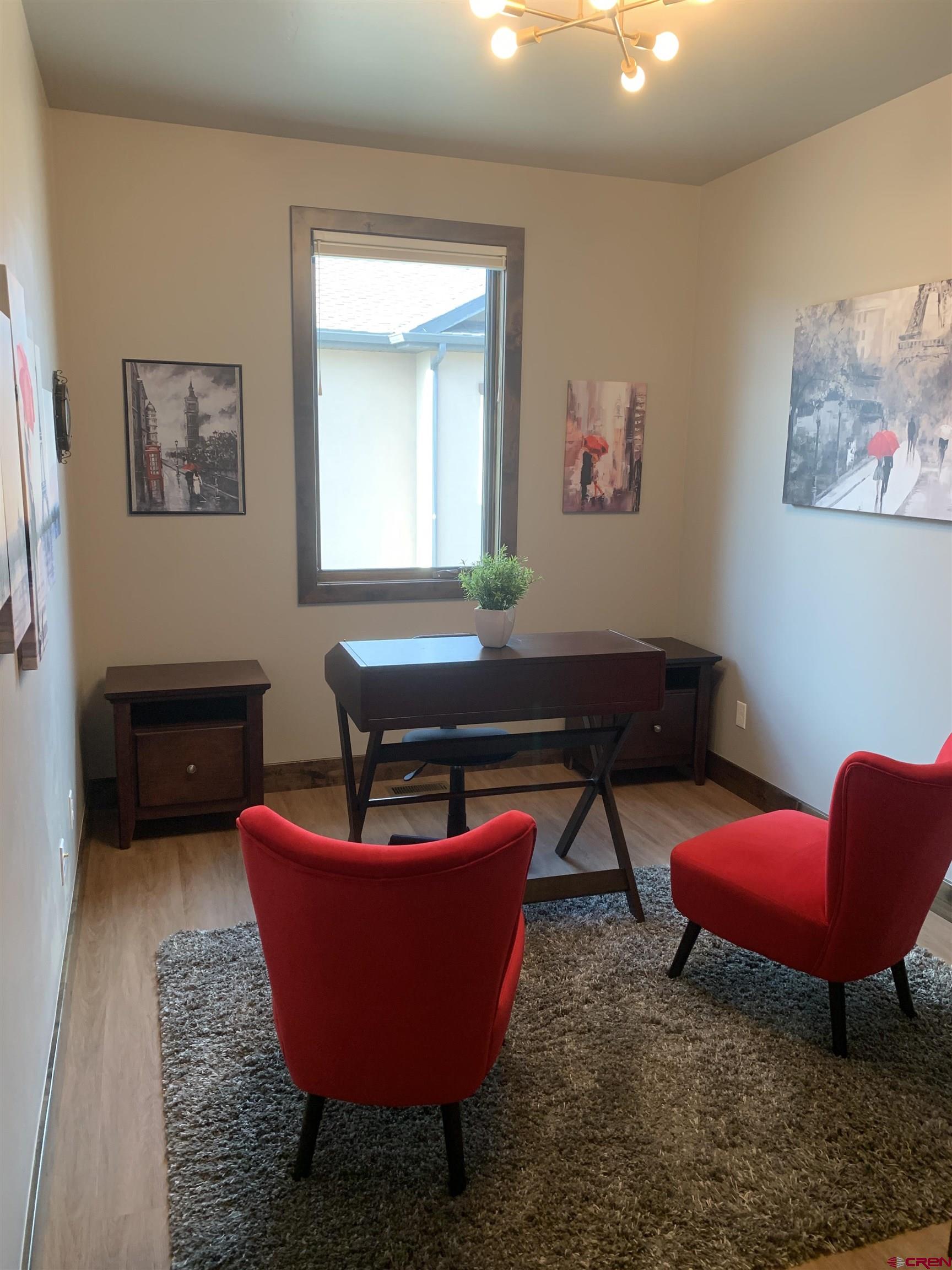 2533 Bear Lake Drive Montrose, CO 81401 - Photo 14 of 34 a room with furniture a rug and a window