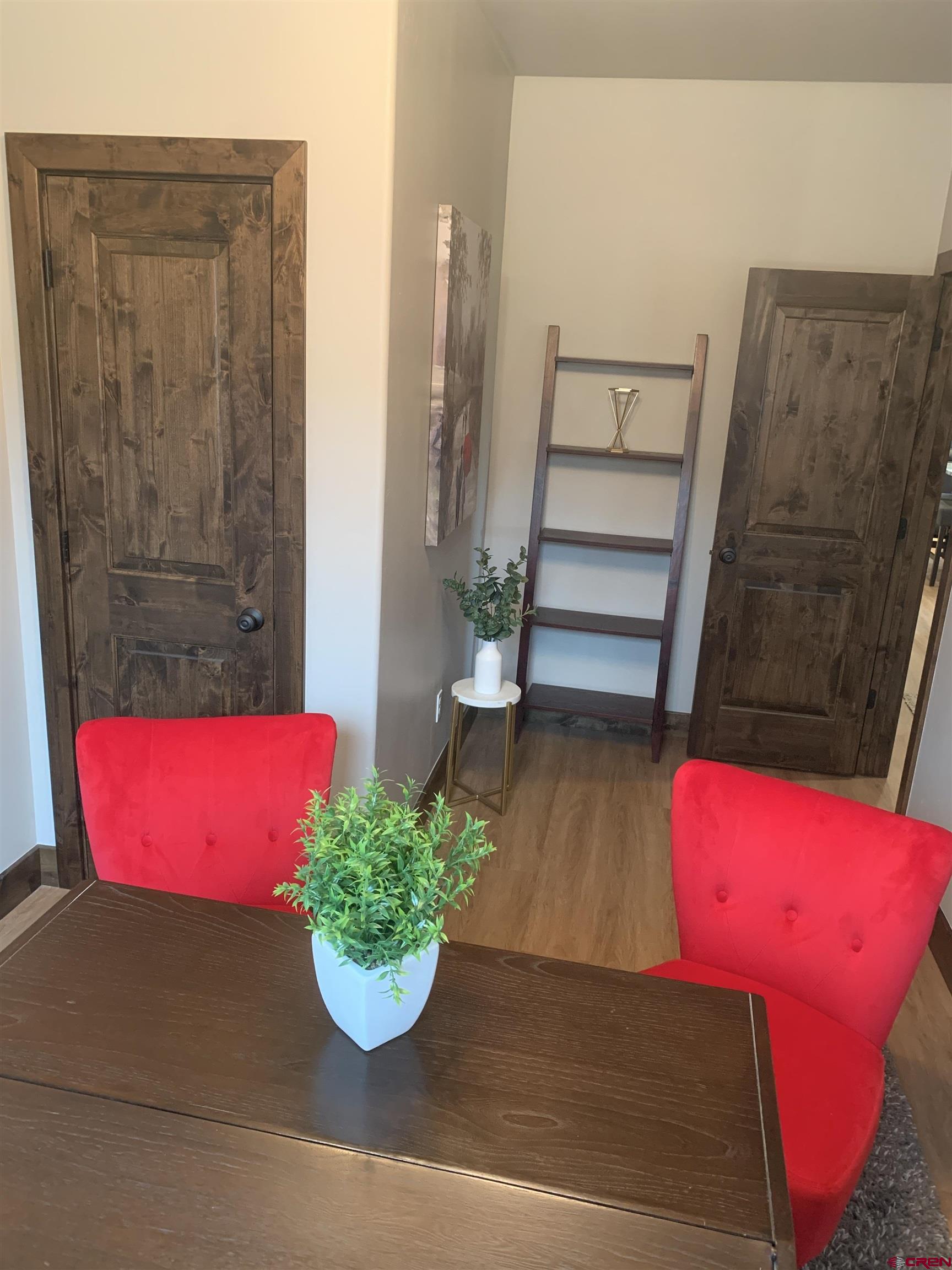 2533 Bear Lake Drive Montrose, CO 81401 - Photo 15 of 34 a view of a room with wooden floor and potted plant