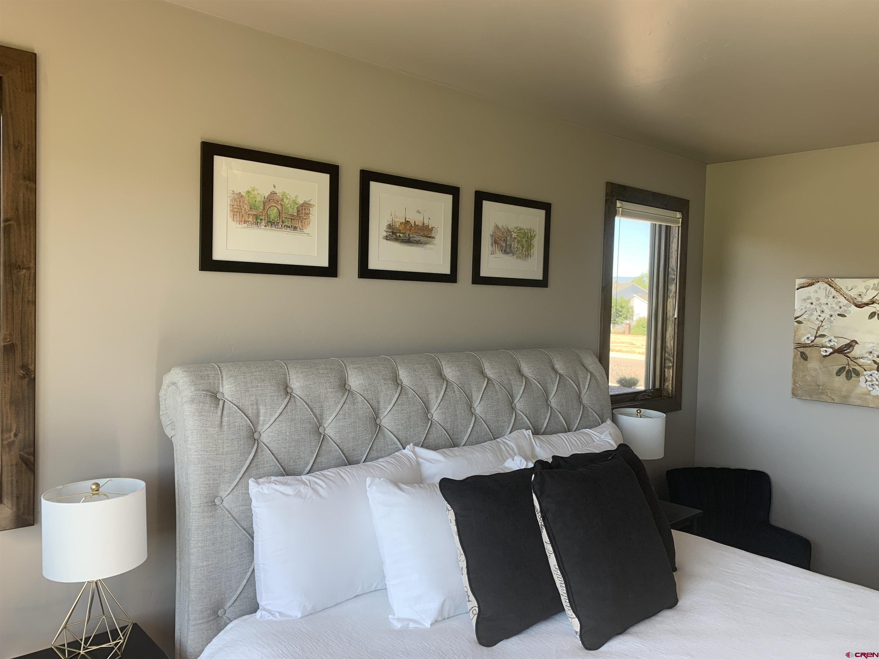 2533 Bear Lake Drive Montrose, CO 81401 - Photo 17 of 34 a living room with furniture and a window
