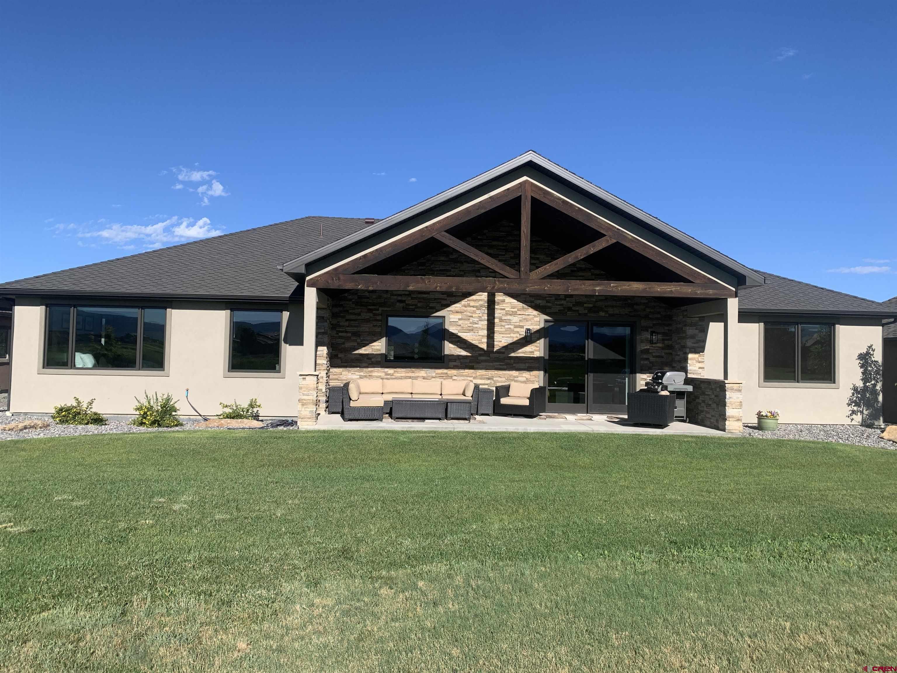 2533 Bear Lake Drive Montrose, CO 81401 - Photo 2 of 34 a view of a house with a yard