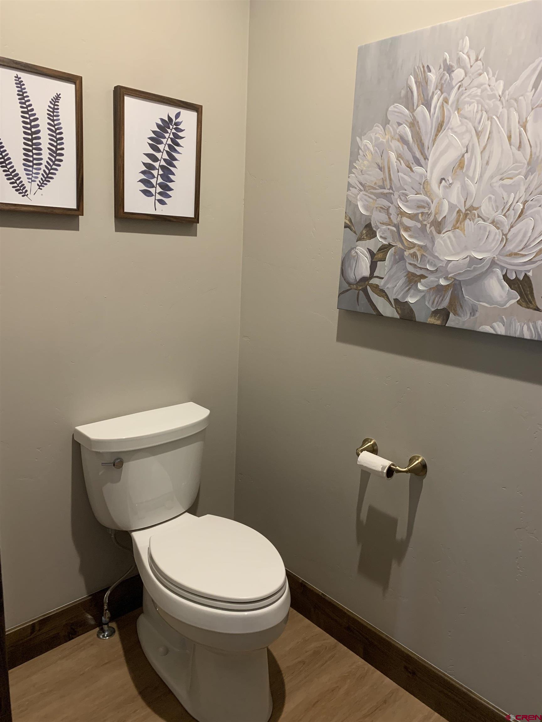 2533 Bear Lake Drive Montrose, CO 81401 - Photo 21 of 34 a white toilet sitting next to a white wall