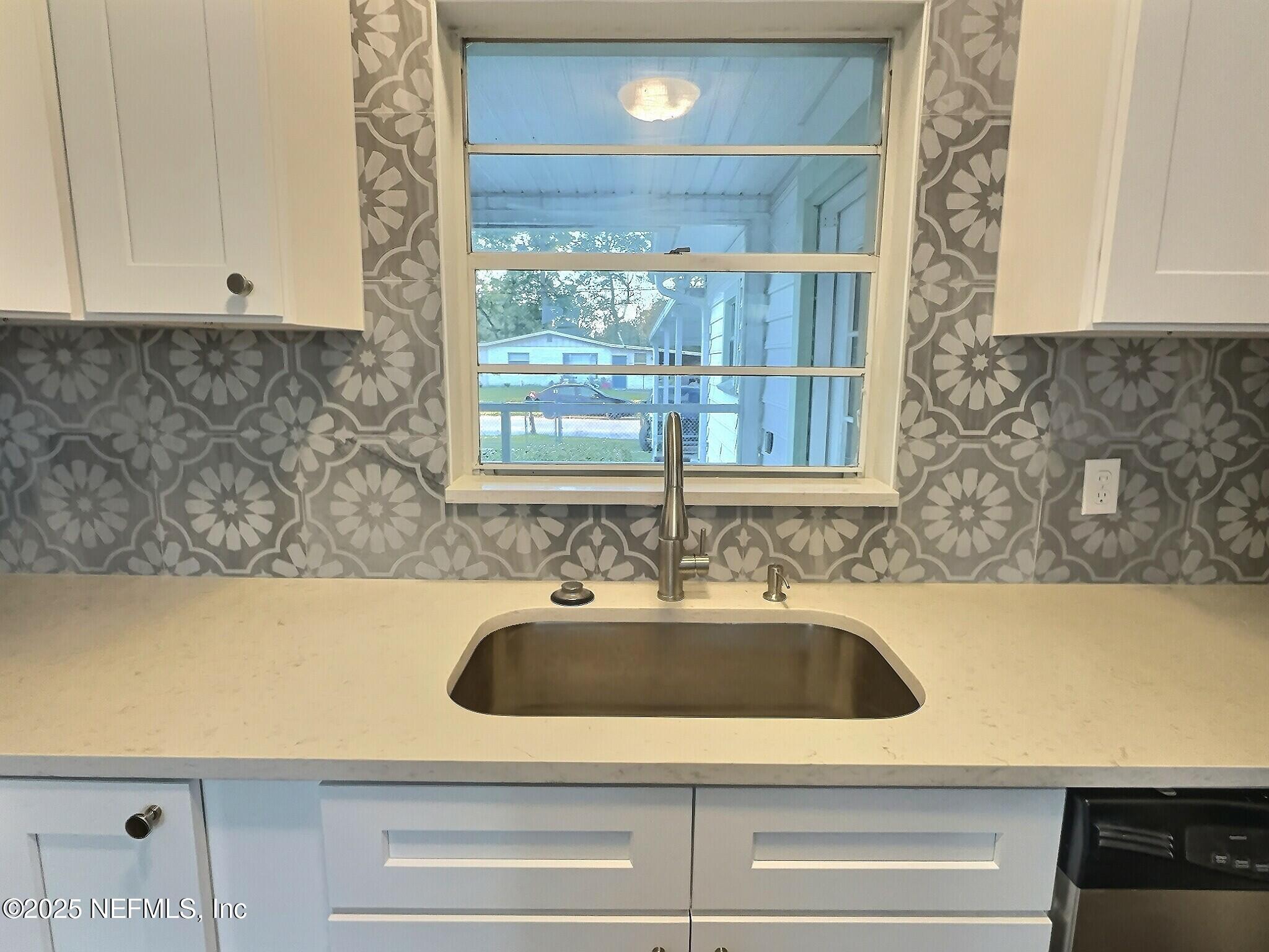 7456 Centauri Road Jacksonville, FL 32210 - Photo 10 of 26 a bathroom with a sink and a bathtub