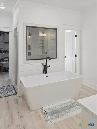 a bathroom with a double vanity sink mirror and