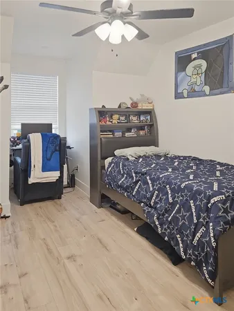 a bathroom with a double vanity sink mirror and toilet