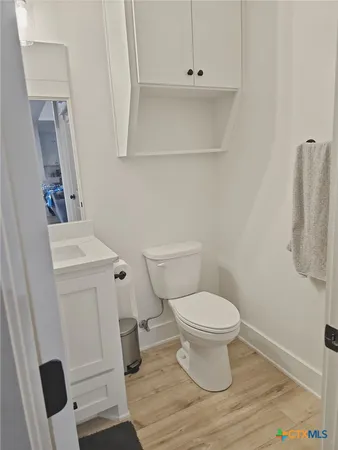 a living room with a table a table and chairs