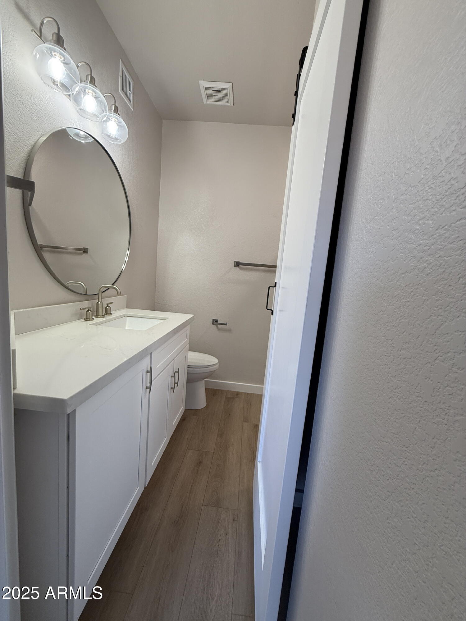 1287 North Alma School Road, Unit 207 Chandler, AZ 85224 - Photo 5 of 9 a bathroom with a double vanity sink and a mirror