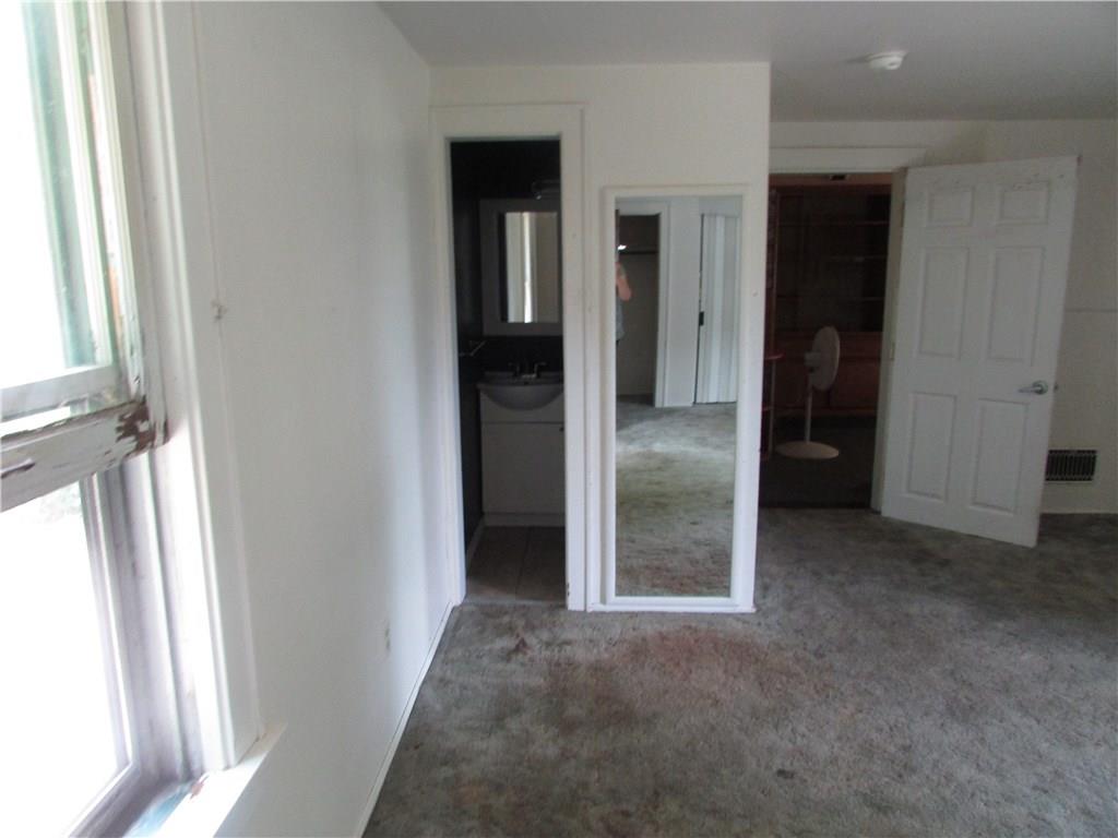 3069 State Road New Castle, PA 16105 - Photo 5 of 10 Main floor master bedroom with half bath