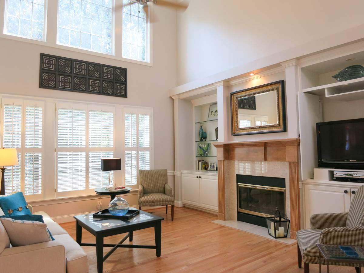 12508 Canolder Street Raleigh, NC 27614 - Photo 5 of 25 The big 2-story tall Living Rm features a CF, wall of windows, and a gas log FP w/marble surround flanked by cabinetry. Living Room