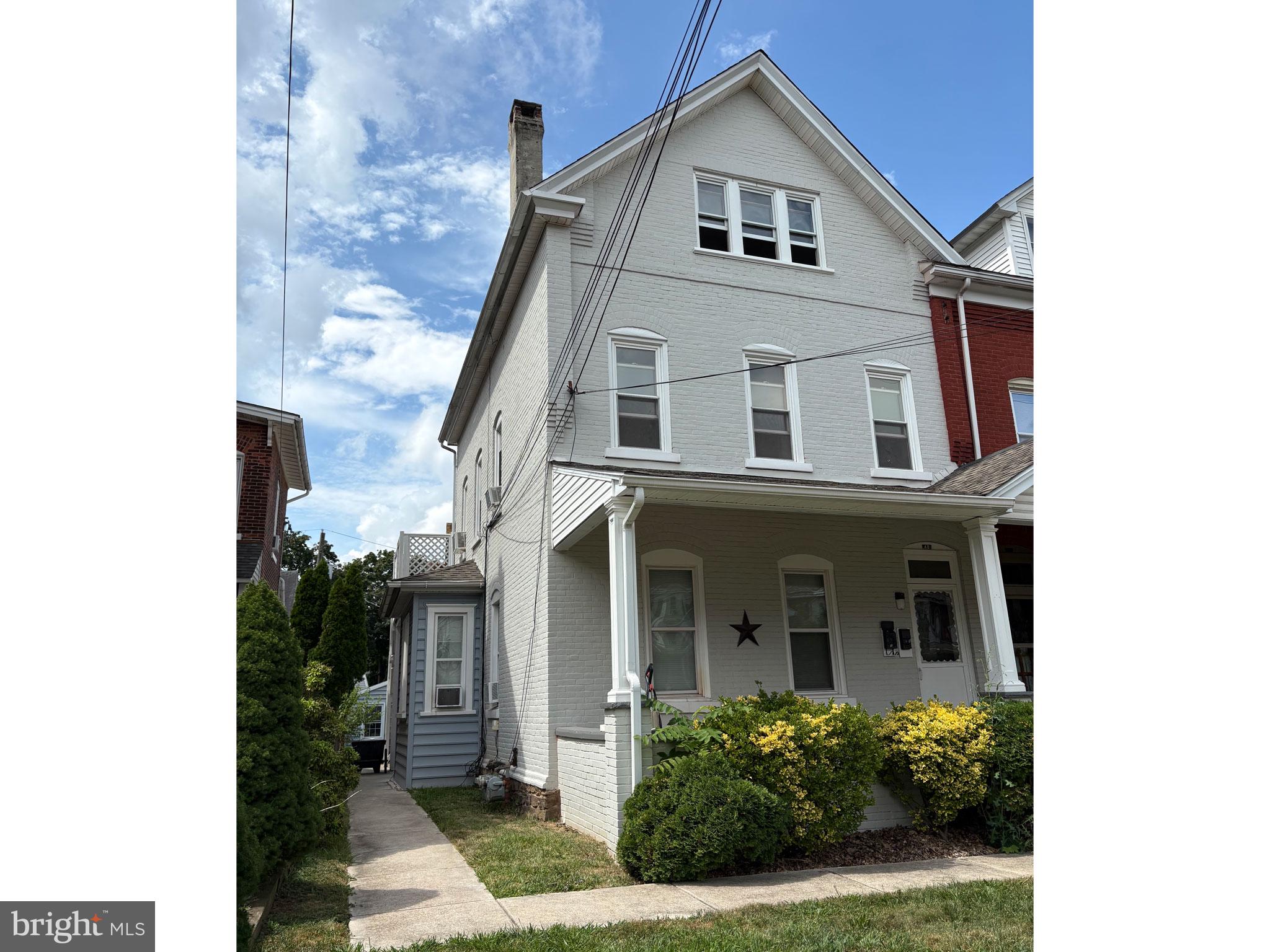 48 Penn Avenue, Unit A Souderton, PA 18964 - Photo 1 of 2 a front view of a house with plants