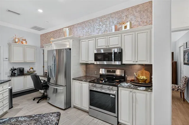 a bedroom with a bed and a television