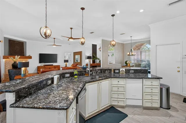 a view of a house with swimming pool and a yard