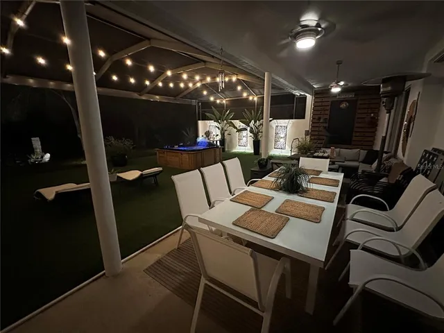 a living room with lots of furniture and a rug