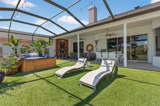 a large kitchen with a table and chairs