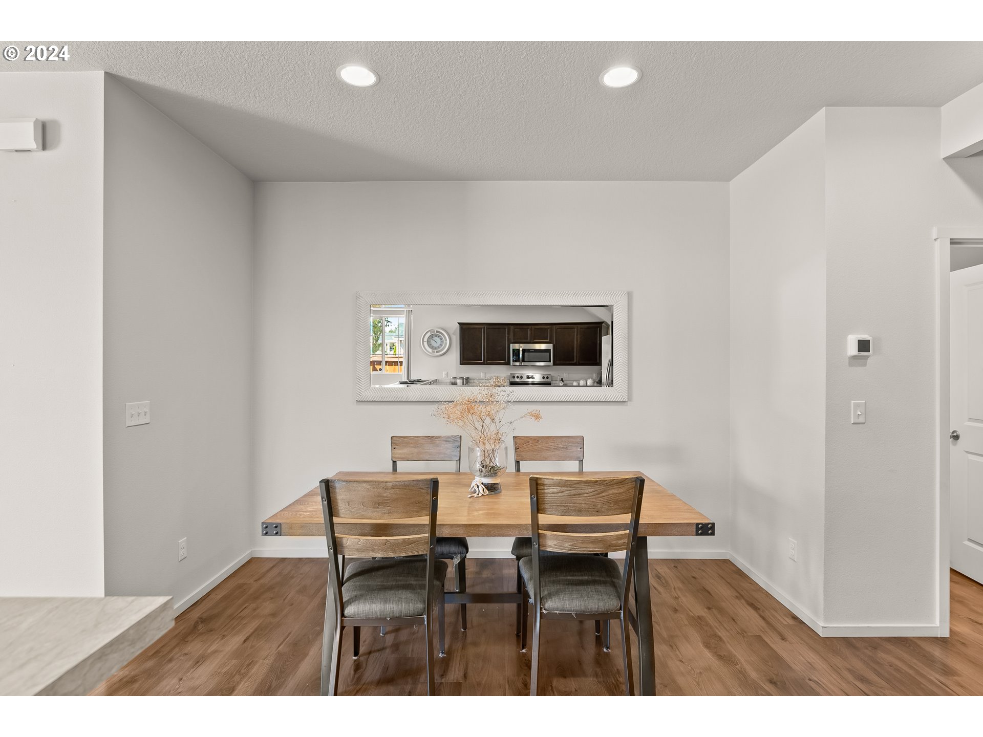 2183 Southeast 19th Street Gresham, OR 97080 - Photo 13 of 26 a view of a dining room with furniture and wooden floor