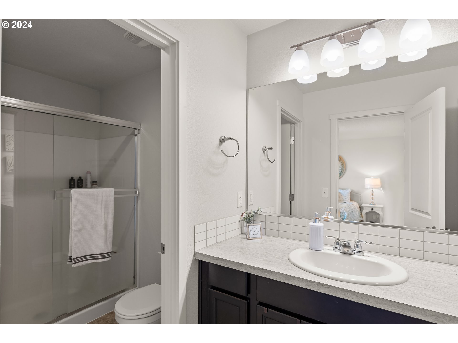 2183 Southeast 19th Street Gresham, OR 97080 - Photo 19 of 26 a bathroom with a sink a mirror and a mirror