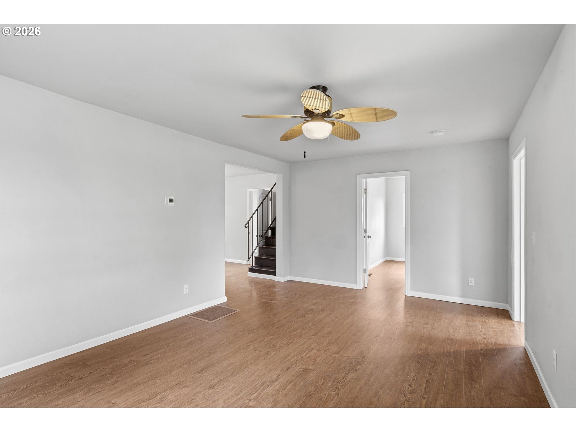 10505 Northwest 2nd Street Portland, OR 97231 - Photo 16 of 39 a view of an empty room with wooden floor and a window