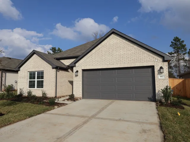 a view of kitchen with stainless steel appliances granite countertop a sink a stove and a microwave