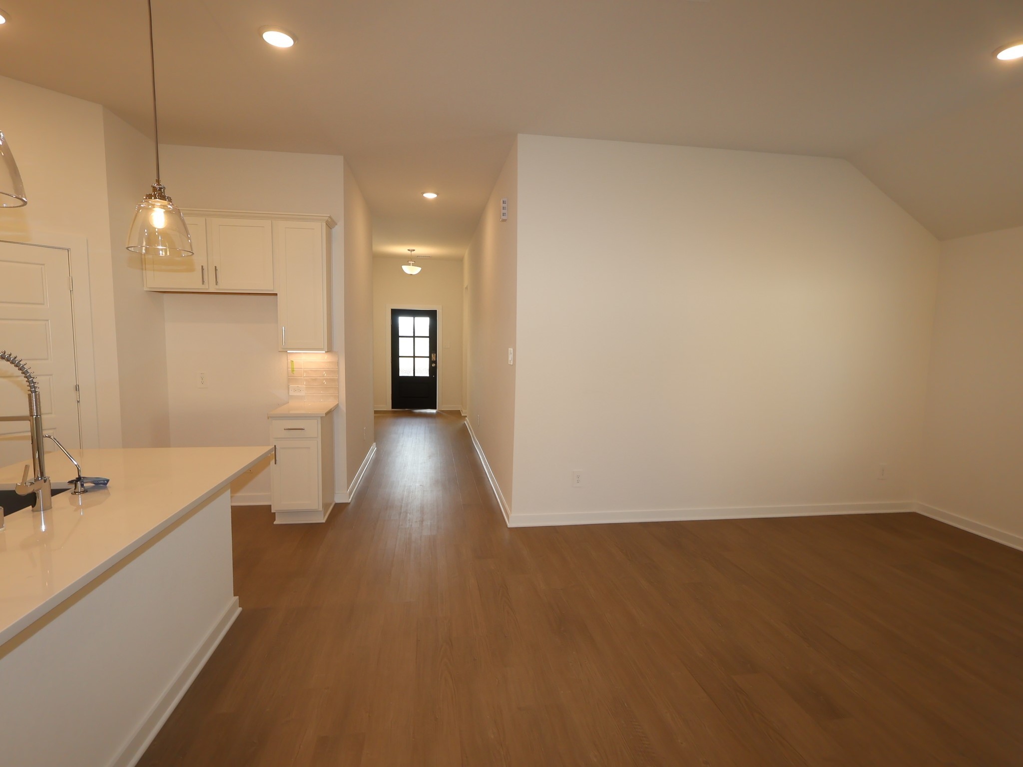 957 Garden Path Drive Willis, TX 77378 - Photo 13 of 37 a view of a kitchen with a sink and a refrigerator