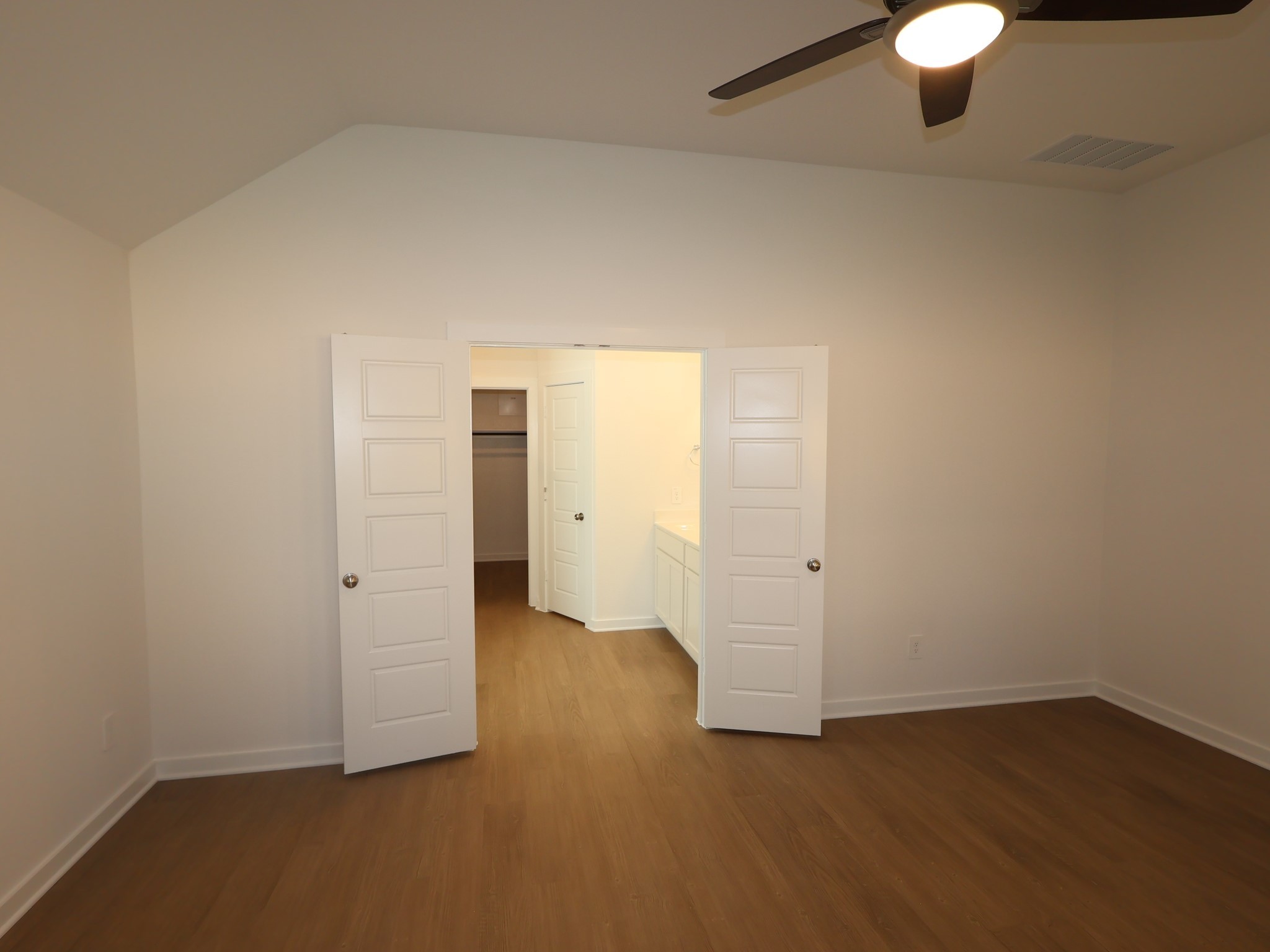 957 Garden Path Drive Willis, TX 77378 - Photo 17 of 37 an empty room with wooden floor and windows