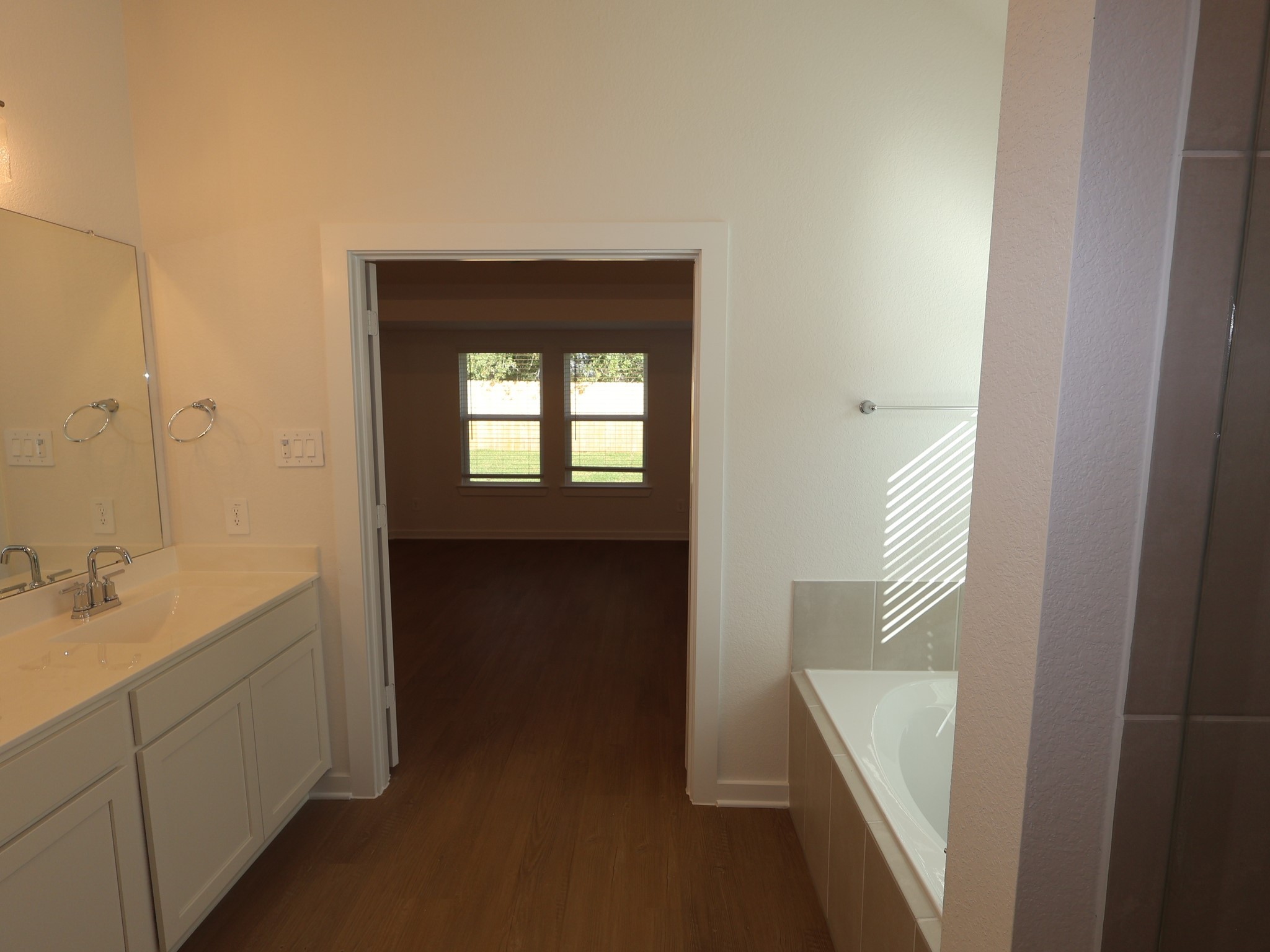 957 Garden Path Drive Willis, TX 77378 - Photo 18 of 37 a en suite bathroom with a sink and a mirror