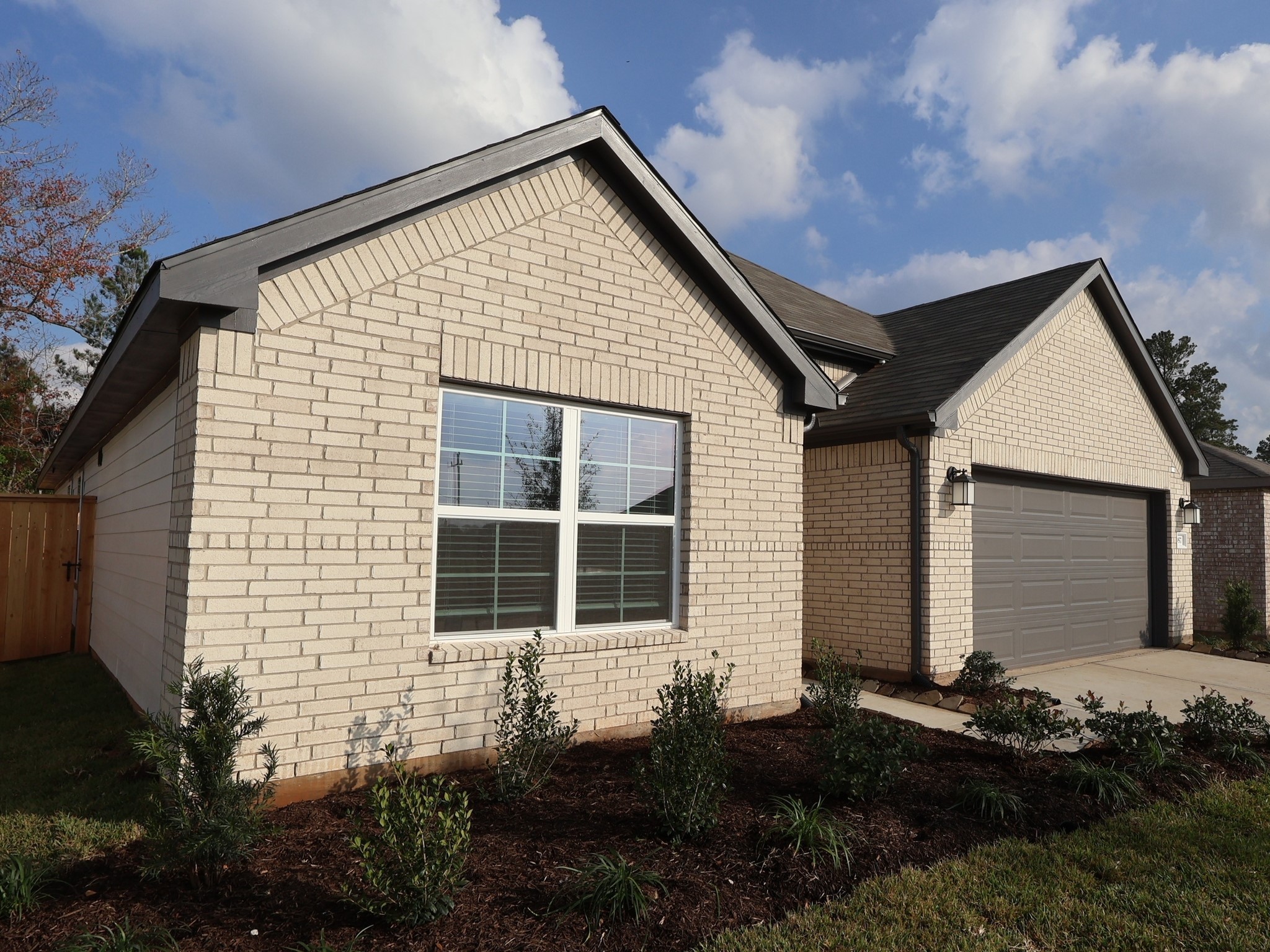 957 Garden Path Drive Willis, TX 77378 - Photo 10 of 37 a front view of a house with a yard