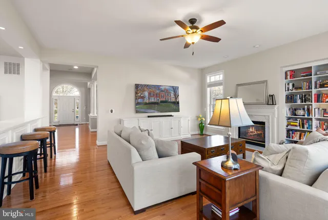 a bedroom with furniture and a large window