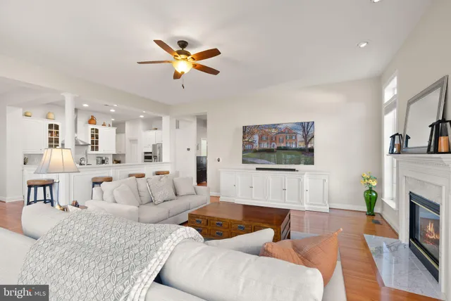a bathroom with a granite countertop sink a toilet and a shower