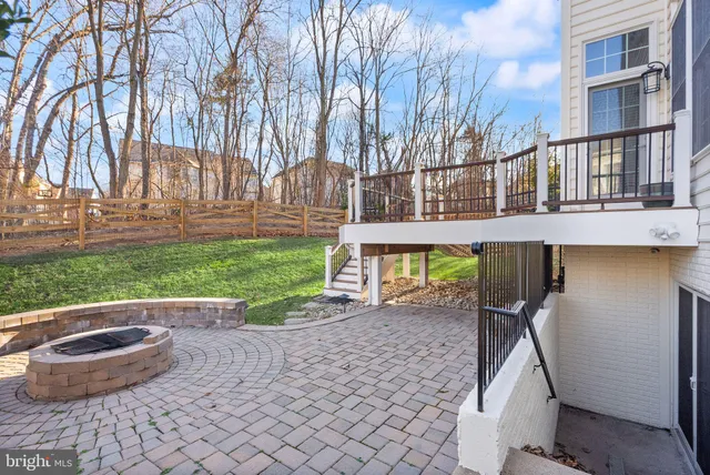 a living room with furniture a flat screen tv and a table