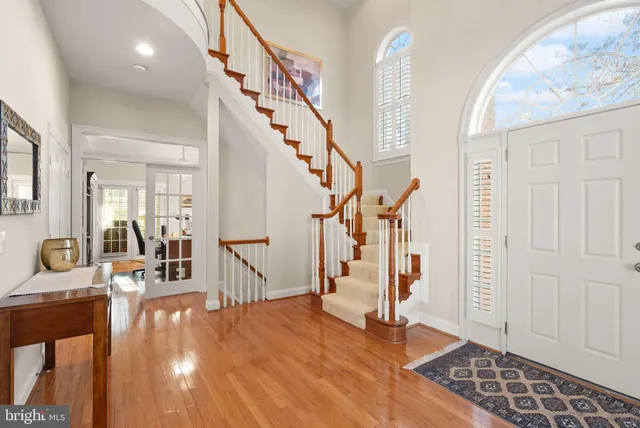 a view of a room with gym equipment and a large window