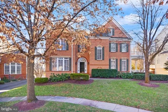 a living room with furniture and a dining table with wooden floor