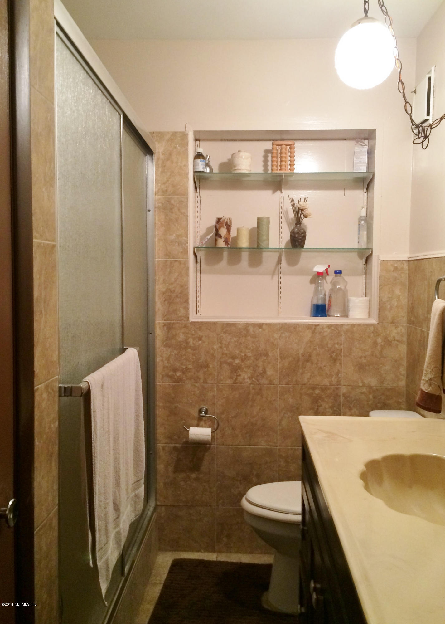 2433 Sam Road Jacksonville, FL 32216 - Photo 14 of 22 a bathroom with a sink a toilet and shower