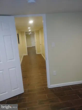 a bathroom with a toilet and a bathtub