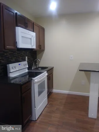 a kitchen with a stove and a microwave