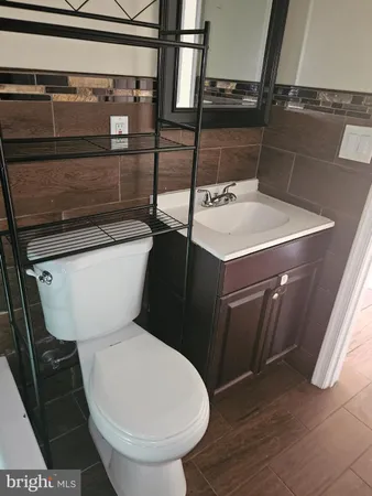 a bathroom with a sink a toilet and bathtub