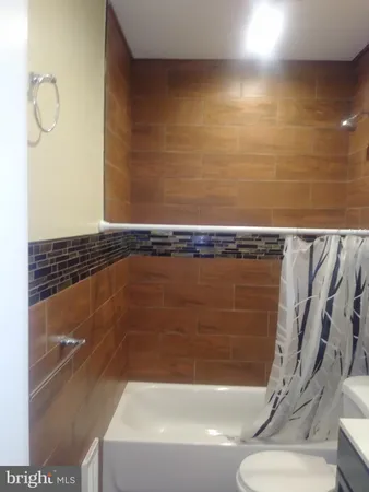a bathroom with a shower and a bathtub