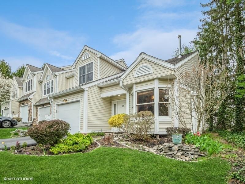 93 Spruce Ridge Drive Fishkill, NY 12524 - Photo 1 of 1 a view of a house with brick walls and a yard with plants