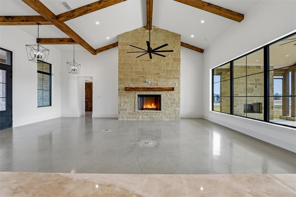 2004 Denali Pass Aledo, TX 76008 - Photo 9 of 40 a view of an empty room with a fireplace and a window