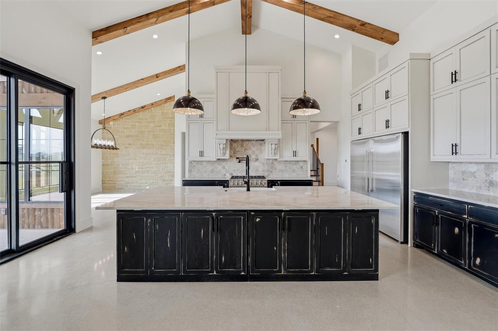 2004 Denali Pass Aledo, TX 76008 - Photo 10 of 40 a kitchen with stainless steel appliances a sink and a refrigerator