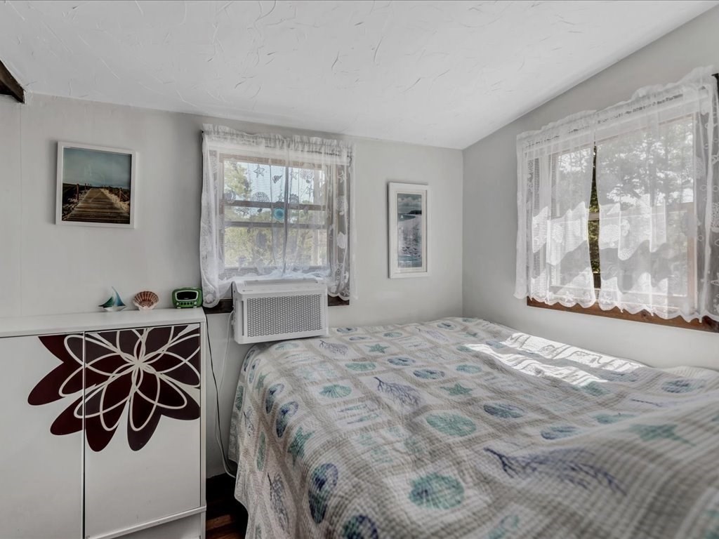 56 Ryder Street Wareham, MA 02532 - Photo 13 of 29 a bedroom with a bed and wooden floor
