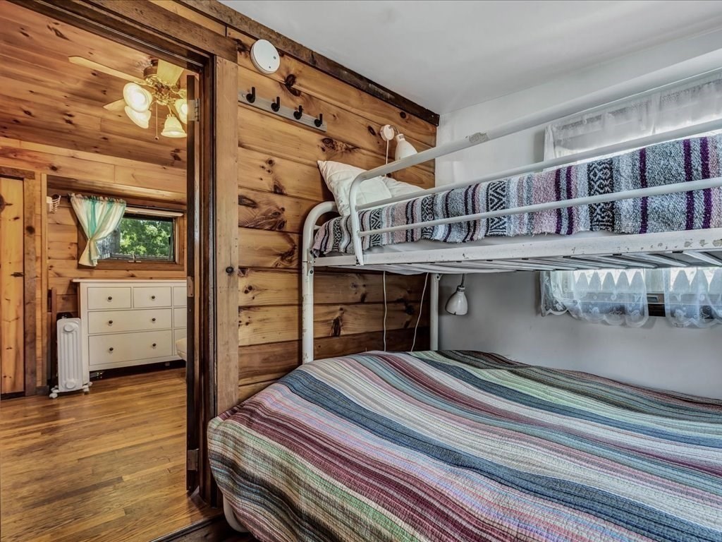 56 Ryder Street Wareham, MA 02532 - Photo 14 of 29 a bedroom with a bed and wooden floor