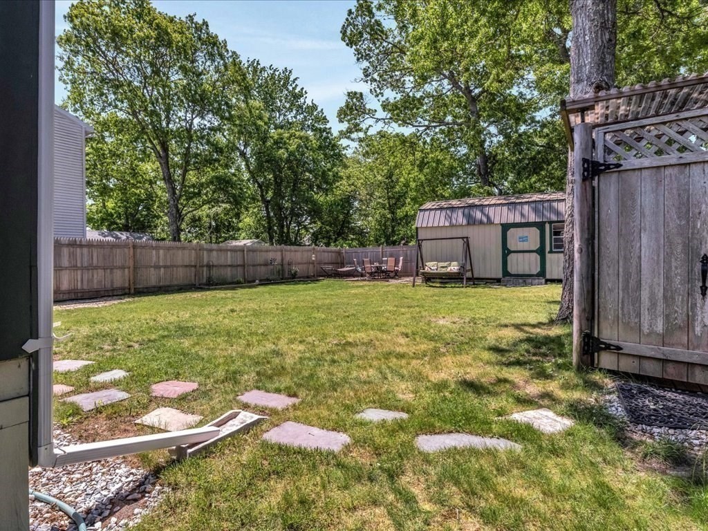 56 Ryder Street Wareham, MA 02532 - Photo 22 of 29 a view of a backyard with a small cabin