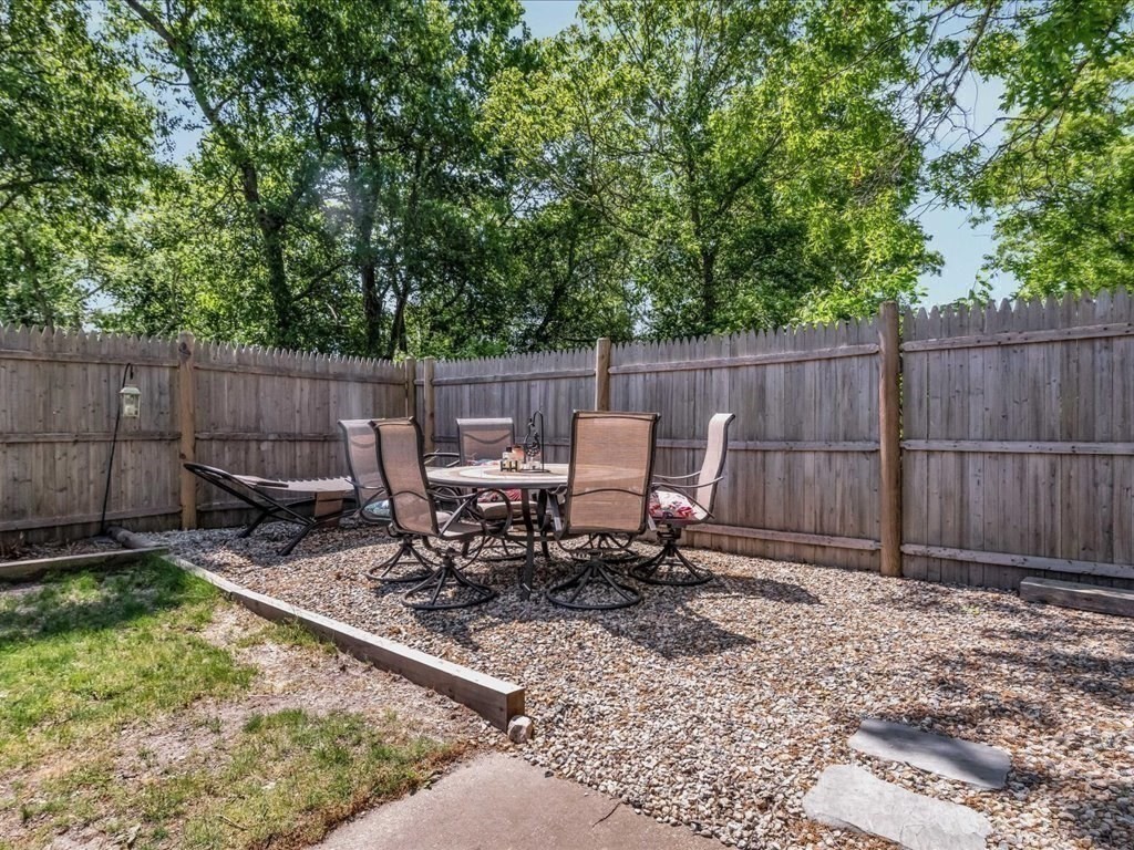 56 Ryder Street Wareham, MA 02532 - Photo 23 of 29 a view of backyard with a table and chairs
