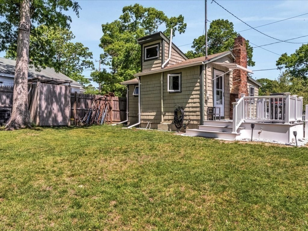 56 Ryder Street Wareham, MA 02532 - Photo 25 of 29 a backyard of a house with barbeque oven