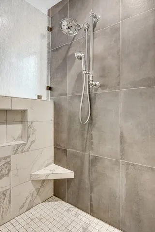 a bathroom with a toilet and shower