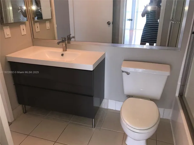 a view of a balcony with wooden floor and city view