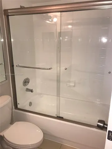 a bathroom with a toilet and a sink