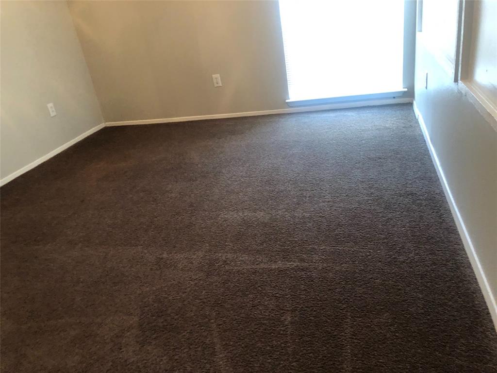 9696 Walnut Street, Unit 2103 Dallas, TX 75243 - Photo 3 of 7 Carpeted interior space featuring neutral wall tones and white baseboards